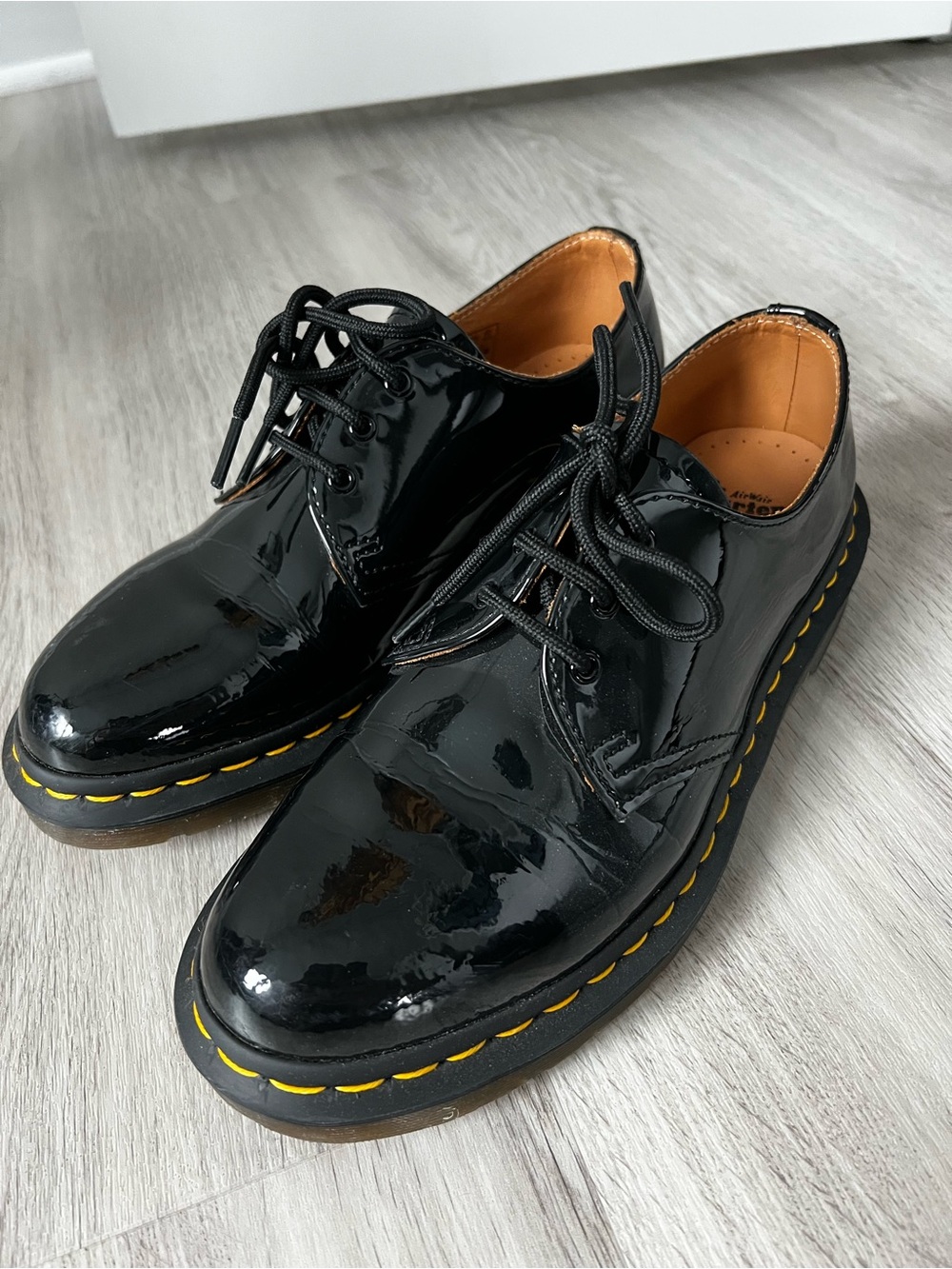 Dr. Martens Black Patent Leather Sneakers with Yellow Stitching